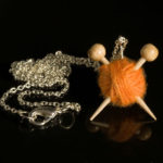Orange Knitting Necklace Knitting Needles and Yarn Ball necklace