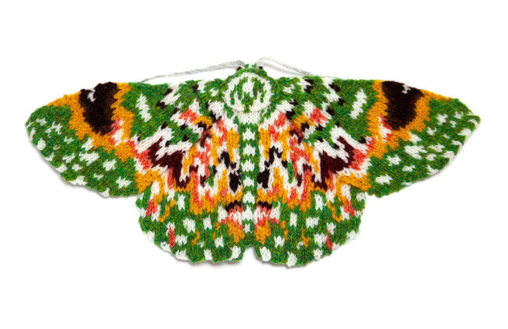 knitted green and orange moth