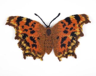 Knitted orange and brown butterfly with scalloped wings