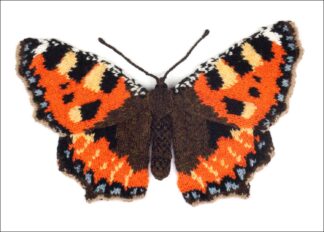 knitted orange and brown butterfly on a white background